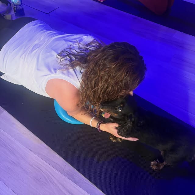 A quiet yoga moment on the mat at Seven Studios